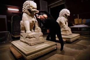 Field Museum President and CEO Richard Lariviere, left, and Exhibitions Conservator Shelley Paine examine Tuesday, Aug. 26, 2014 one of two stone lions from 13th century China that will be part of Cyrus Tang Hall of Chine, a upcoming, permanent exhibit announced today at the museum. (Chris Walker/Chicago Tribune) B583963750Z.1 -ent-0827-field-china ....OUTSIDE TRIBUNE CO.- NO MAGS, NO SALES, NO INTERNET, NO TV, CHICAGO OUT, NO DIGITAL MANIPULATION...